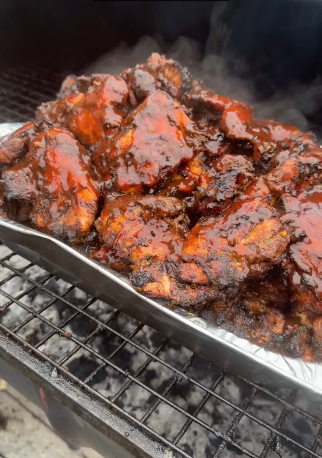 Grilled jerk-style chicken fresh off the grill